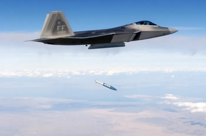 Framed Print : F-22 Raptor releases a 1 000-pound over the Utah Test and Training Range during weapons evaluation. October 20 2005. (BSLOC_2011_12_219)