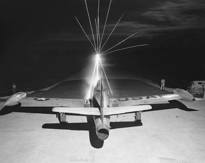 Framed Print : F-84 Thunderjet firing.50 caliber tracer bullets as maintenance men test the wing guns Framed Print : F-84 Thunderjet firing.50 caliber tracer bullets as maintenance men test the wing guns