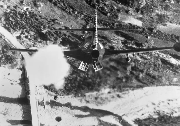 Framed Print : F-84 Thunderjet from the USS Bon Homme Richard, is shown rocketing and bombing Korean bridge. Nov. 11, 1952 during the Korean War. (BSLOC_2014_11_230)