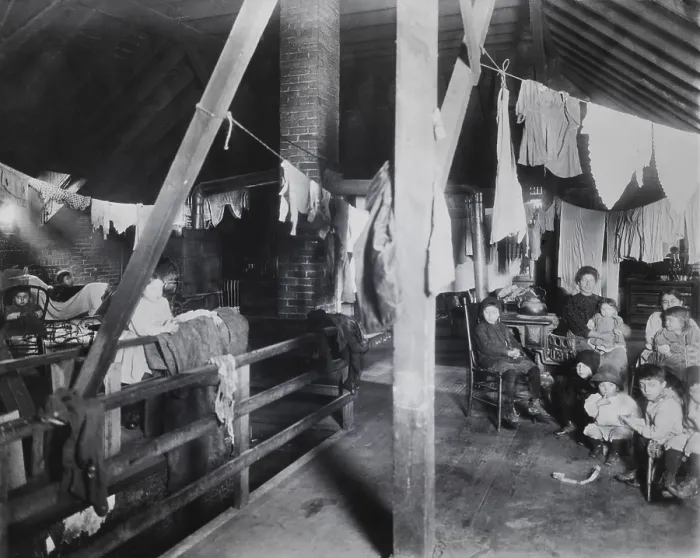 Framed Print : Family in an attic home with drying laundry Framed Print : Family in an attic home with drying laundry