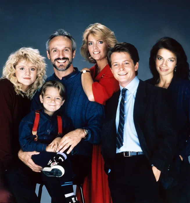 Framed Print : FAMILY TIES, from left: Tina Yothers, Brian Bonsall, Michael Gross, Meredith Baxter, Michael J. Fox, Justine Bateman, 1982-89