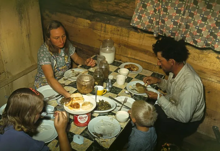 Framed Print : Faro Caudill's family dinner in their dugout home in Pie Town New Mexico. They were among 250 homesteaders families who migrated from the Dust Bowl