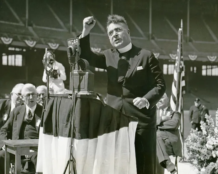 Framed Print : Father Coughlin (1891-1979), Father Coughlin addresses large Cleveland rally with right fist raised, speaking at rally, prior to Ohio primary, at a stadium in Cleveland, Ohio