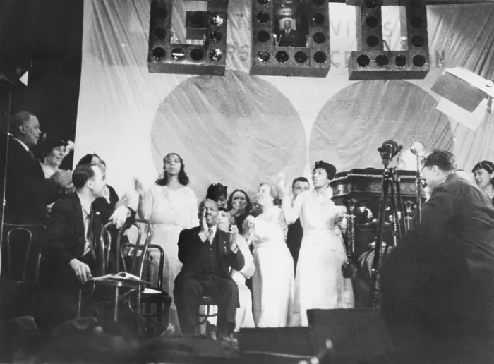 Framed Print : Father Divine leading the singing at one of his meetings