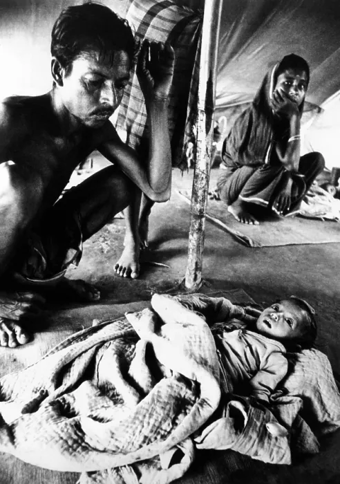Framed Print : Father's vigil over his dying son in a refugee camp during the Bangladesh Liberation War in 1971