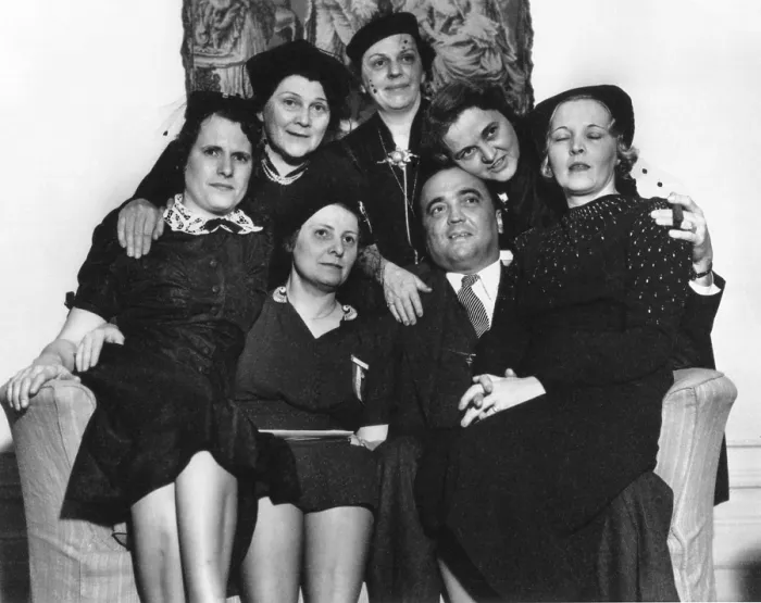 Framed Print : FBI Director J. Edgar Hoover on a loveseat with six women at the Willard Hotel, Washington, D.C Framed Print : FBI Director J. Edgar Hoover on a loveseat with six women at the Willard Hotel, Washington, D.C