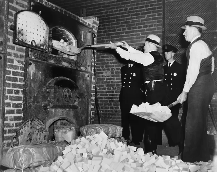 Framed Print : Federal Bureau of Narcotics agents shovel confiscated heroin blocks into incinerator in 1936 Framed Print : Federal Bureau of Narcotics agents shovel confiscated heroin blocks into incinerator in 1936