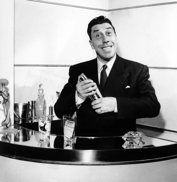 Framed Print : Fernandel, mixing a cocktail at his home bar after work, 1958 Framed Print : Fernandel, mixing a cocktail at his home bar after work, 1958