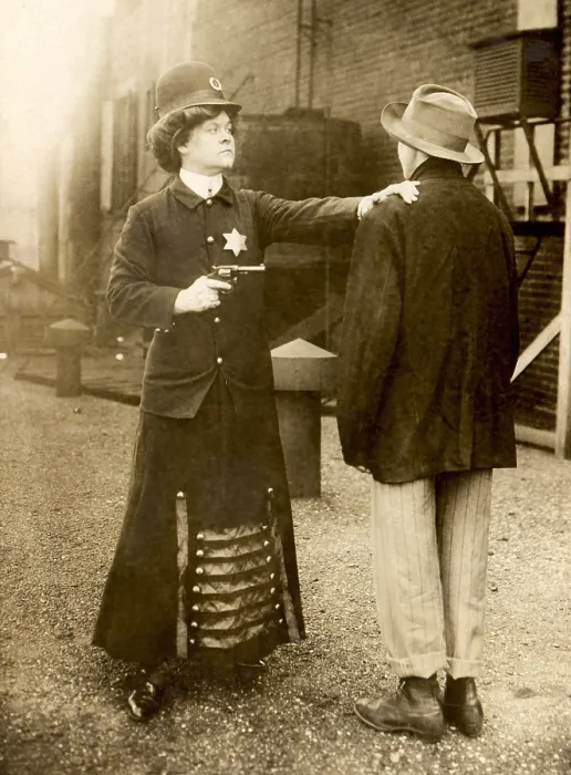 Framed Print : Fictional photo of a woman policeman arresting a man, Sept. 1909 Framed Print : Fictional photo of a woman policeman arresting a man, Sept. 1909