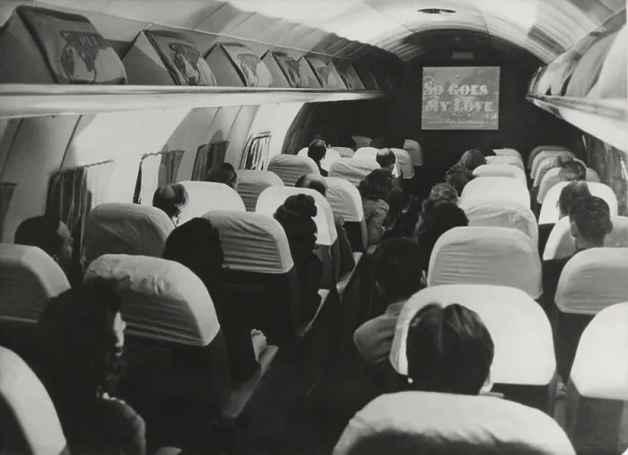 Framed Print : The film, So Goes my Love is projected on a Pan American Clipper, August 6, 1946. It was the first film shown during a cross-Atlantic flight. - (BSLOC_2014_17_128)