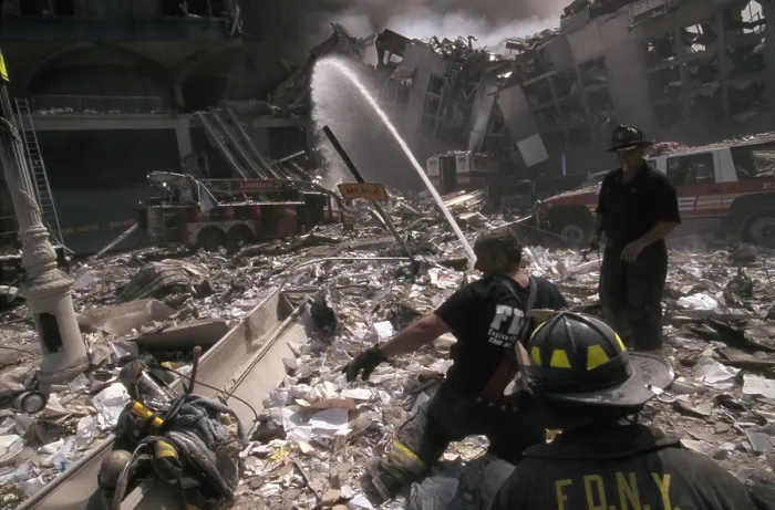 Framed Print : Fire fighters set up a hose amid smoking rubble following September 11th terrorist attack on World Trade Center. At left is still standing WTC 6 Framed Print : Fire fighters set up a hose amid smoking rubble following September 11th terrorist attack on World Trade Center. At left is still standing WTC 6