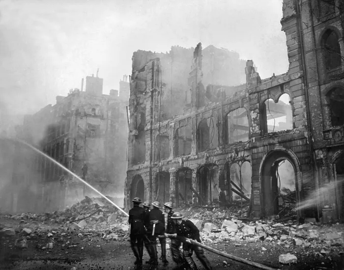 Framed Print : Fire fighting during World War 2 Battle of Britain. Firemen at work in bomb-damaged street in London, after Saturday night raid, ca. 1941. (BSLOC_2013_11_85)