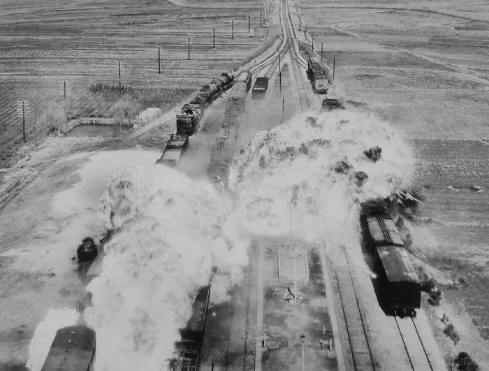 Framed Print : Two fireballs of napalm explode on North Korean railroad cars on the main rail line from Wonsan. Bombs of jellied gasoline were dropped from U.S