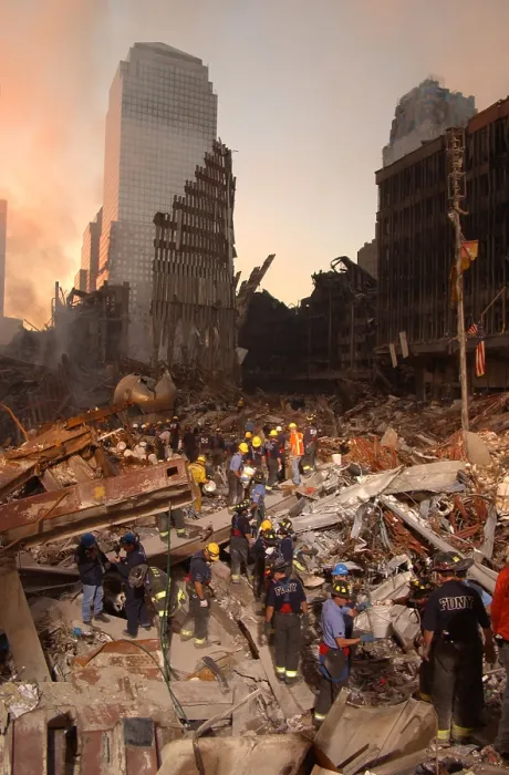 Framed Print : Firefighters and search and rescue teams work on The Pile of rubble from the collapsed World Trade Center