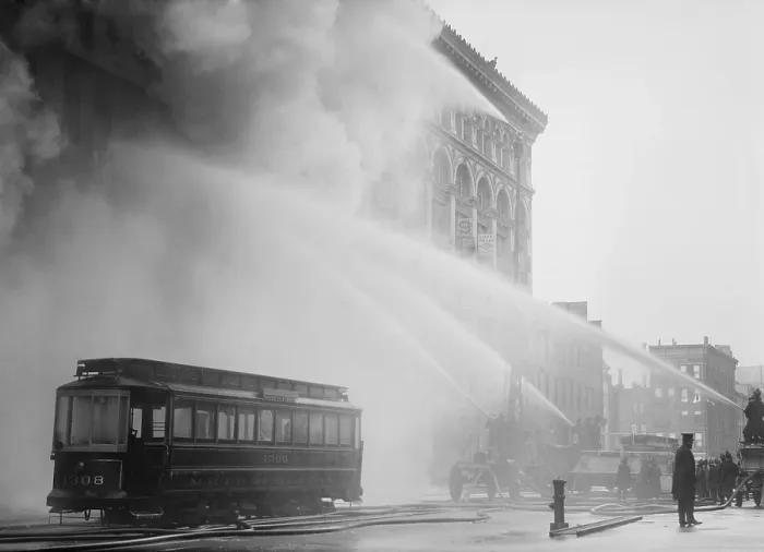 Framed Print : Firemen spraying three streams of high pressure water on a fire on 14th St. NYC, Dec. 1909. An abandoned trolley stands in the foreground (BSLOC_2017_17_101) Framed Print : Firemen spraying three streams of high pressure water on a fire on 14th St. NYC, Dec. 1909. An abandoned trolley stands in the foreground (BSLOC_2017_17_101)