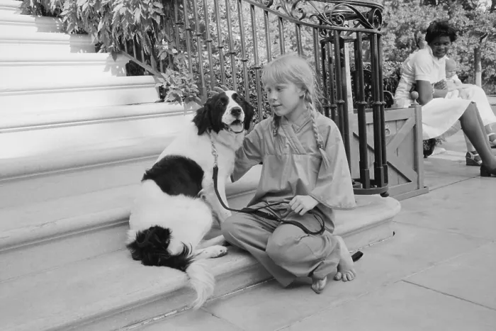 Framed Print : First daughter Amy Carter with her dog, Grits. The dog was a gift from her teacher. Ca. 1978