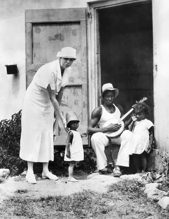 Framed Print : First Lady Eleanor Roosevelt chatting with the Winn family, of Christiansted, St. Croix. They live in Public Works Administration (PWA) housing. March 12, 1934 Framed Print : First Lady Eleanor Roosevelt chatting with the Winn family, of Christiansted, St. Croix. They live in Public Works Administration (PWA) housing. March 12, 1934