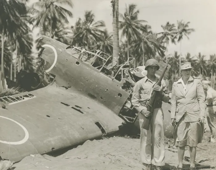Framed Print : First Lady Eleanor Roosevelt visiting Guadalcanal, Sept 13-16, 1943. She stands with sentry, Pvt. Clarence D. Robertson, of Tulsa, Oklahoma, near wrecked Zeroes