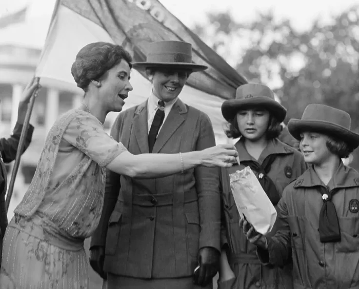 Framed Print : First Lady Grace Coolidge enthusiastically samples Girl Scout Cookies. October 17, 1923. (BSLOC_2015_16_41)
