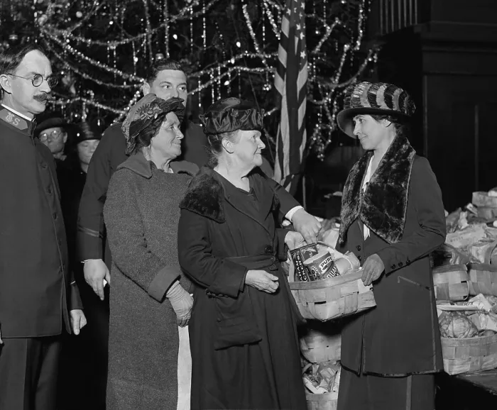 Framed Print : First Lady Grace Coolidge with Salvation Army Group, Dec. 24, 1923. She holds a food basket containing Quaker Oats and Graham Crackers and other staples. (BSLOC_2015_15_154)