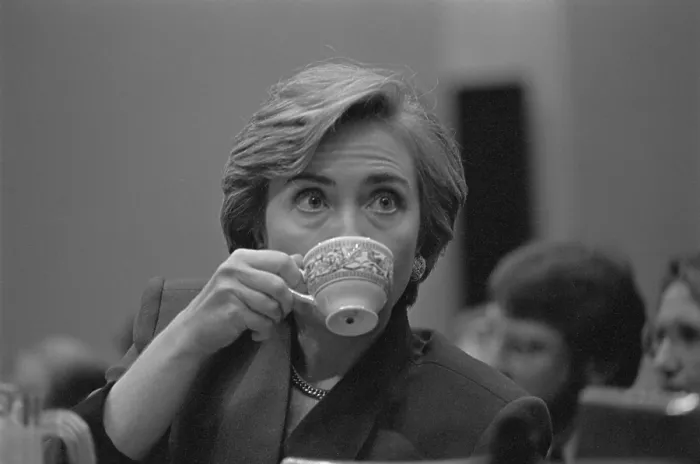 Framed Print : First Lady Hillary Rodham Clinton, during her presentation on health care to Congress. She sips from a teacup, Sept. 1993 (BSLOC_2016_12_1) Framed Print : First Lady Hillary Rodham Clinton, during her presentation on health care to Congress. She sips from a teacup, Sept. 1993 (BSLOC_2016_12_1)