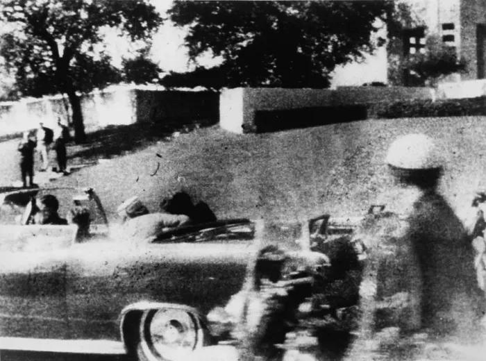 Framed Print : First Lady Jacqueline Kennedy turns to the wounded John Kennedy in the Presidential limousine during his assassination on November 22, 1963 Framed Print : First Lady Jacqueline Kennedy turns to the wounded John Kennedy in the Presidential limousine during his assassination on November 22, 1963