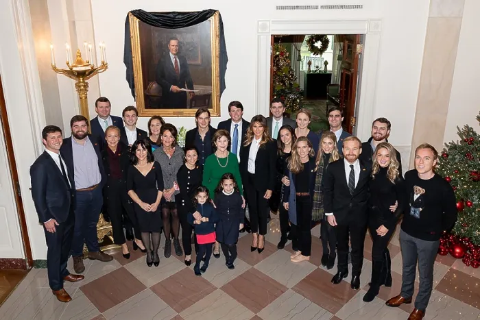 Framed Print : First Lady Melania Trump with former First Lady Laura Bush and extended Bush family members in front of the draped portrait of the late President, George H.W. Bush, Tuesday, Dec