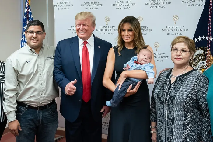 Framed Print : First Lady Melania Trump holds the orphaned, two-month-old Paul, son of Jordan and Andre Anchondo, who were killed in the mass shooting at an El Paso Wal-Mart on August 3, 2017