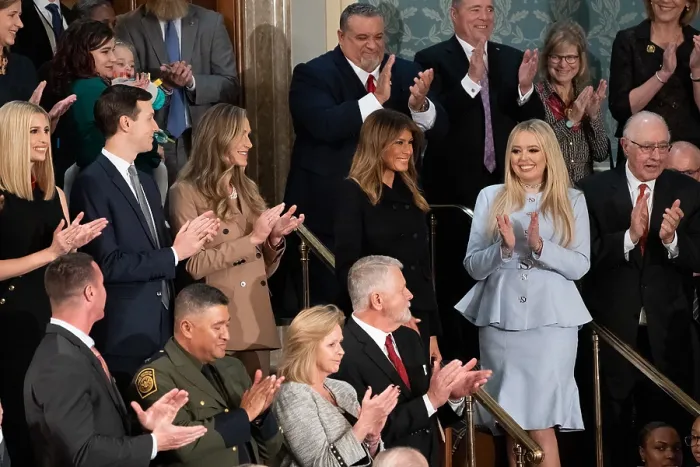 Framed Print : First Lady Melania Trump receives applause as she arrives at the gallery of the House chamber. At right in a pale blue dress, is her step-daughter, Tiffany Trump
