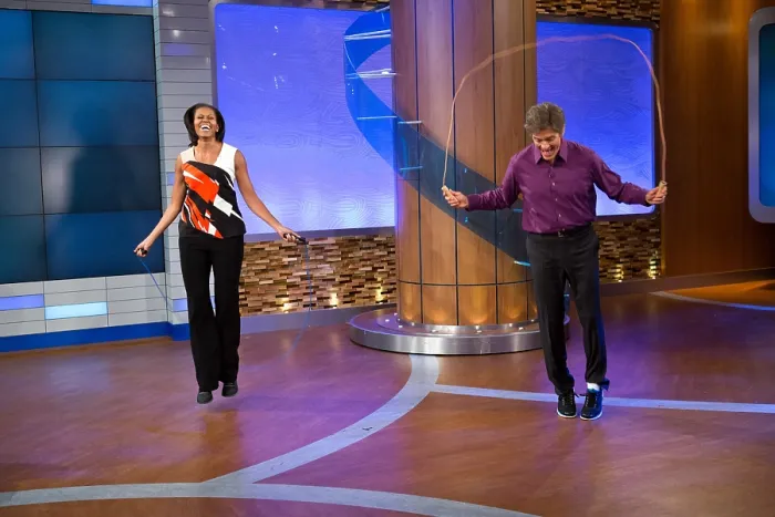 Framed Print : First Lady Michelle Obama and Dr. Mehmet Oz jump during a taping of the Dr. Oz Show'. First Lady's discussed improvements to federal guidelines for school lunches Framed Print : First Lady Michelle Obama and Dr. Mehmet Oz jump during a taping of the Dr. Oz Show'. First Lady's discussed improvements to federal guidelines for school lunches