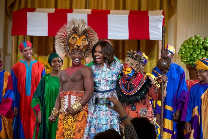 Framed Print : First Lady Michelle Obama joins the cast of Disney's The Lion King on stage at the White House. They performed at the Kids State Dinner in the East Room