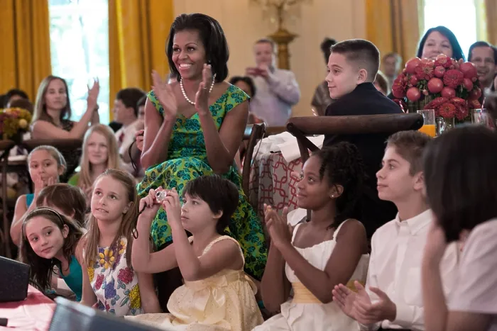 Framed Print : First Lady Michelle Obama during the Kids State Dinner in the East Room of the White House. They watch a performance of Big Time Rush'. Aug Framed Print : First Lady Michelle Obama during the Kids State Dinner in the East Room of the White House. They watch a performance of Big Time Rush'. Aug