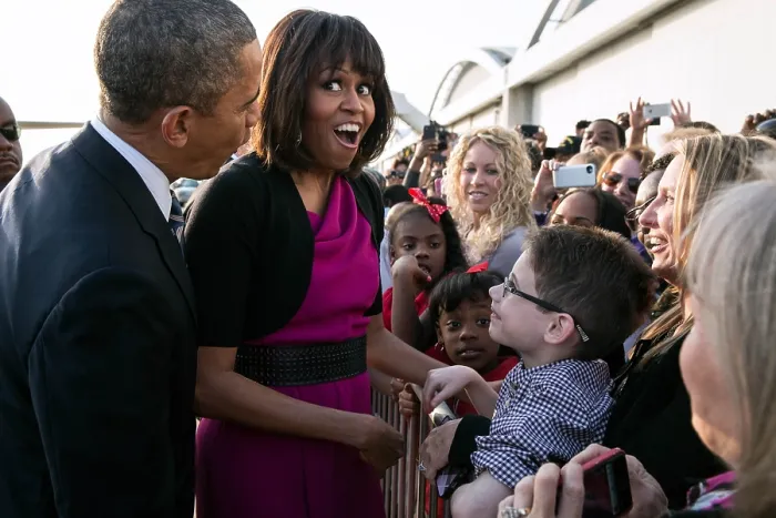 Framed Print : First Lady Michelle Obama reacts while talking with people along a rope line. She and President Barack Obama were at Love Field Airport in Dallas, Texas, April 24, 2013