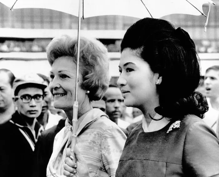 Framed Print : First Lady Pat Nixon (left) and Imelda Marcos stand under an umbrella at Manila airport Framed Print : First Lady Pat Nixon (left) and Imelda Marcos stand under an umbrella at Manila airport