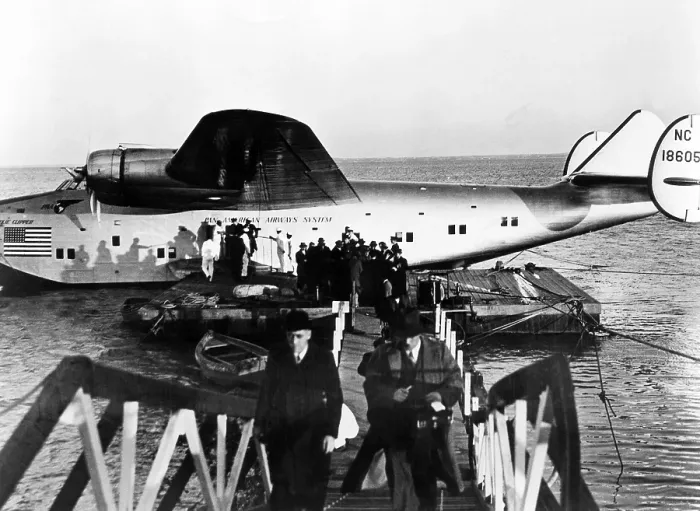 Framed Print : The first passengers to cross the Atlantic leave Pan American's Dixie Clipper airplane in Lisbon, Portugal. The plane took off from Port Washington, New York, 1939