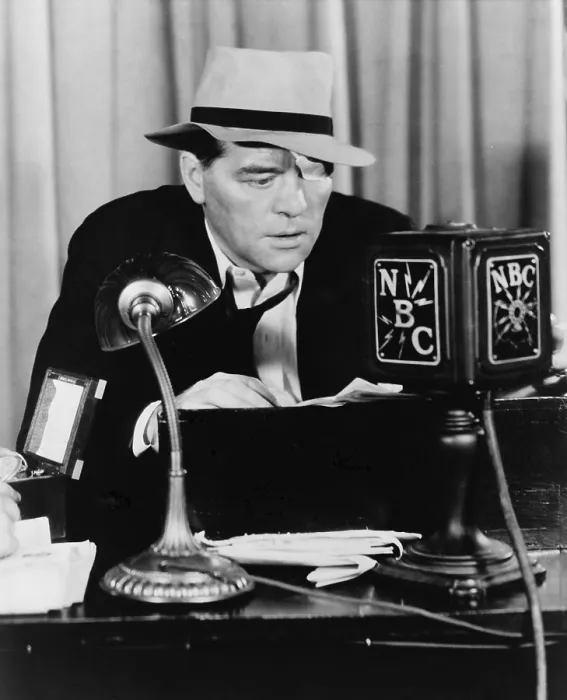 Framed Print : Floyd Gibbons (1887-1939), broadcasting news into N.B.C. Radio microphone in 1930