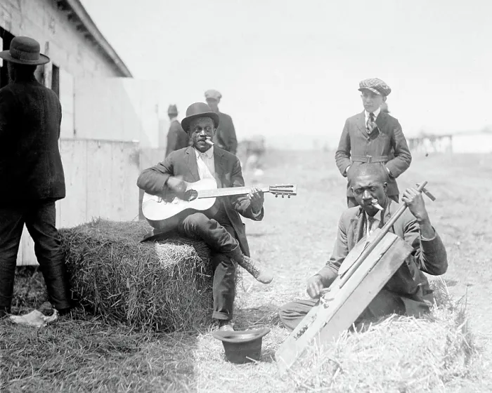 Framed Print : Folk Music. Two musicians sitting on bales of hay and playing instruments outside a barn, ca. 1918 Framed Print : Folk Music. Two musicians sitting on bales of hay and playing instruments outside a barn, ca. 1918