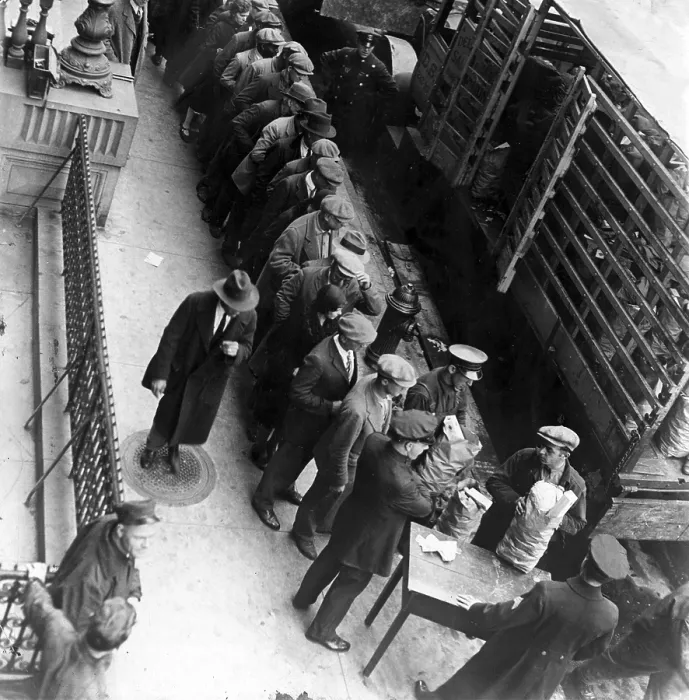 Framed Print : Food handouts in New York in 1930. Police stations were used as distribution centers. Photo shows food being distributed in front of the East 104th Stree station house Framed Print : Food handouts in New York in 1930. Police stations were used as distribution centers. Photo shows food being distributed in front of the East 104th Stree station house