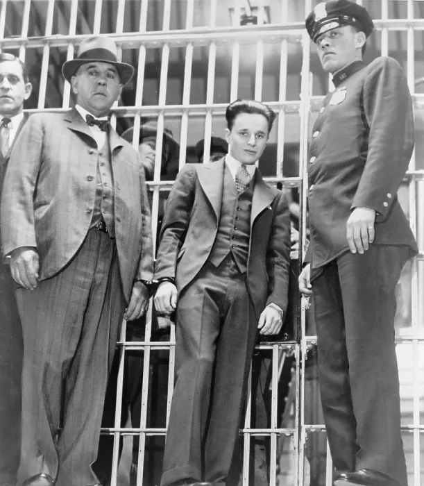 Framed Print : Francis Two Gun Crowley (1911-1932), hand cuffed to a law enforcement officer, as he leaves the jail in Mineola, New York
