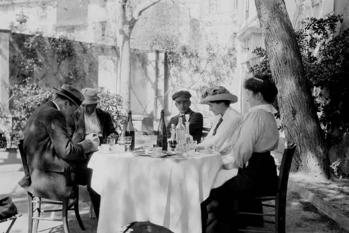 Framed Print : Francis Picabia (1879-1953), French painter, (center) with friends at an outdoor caf. Ca. 1915