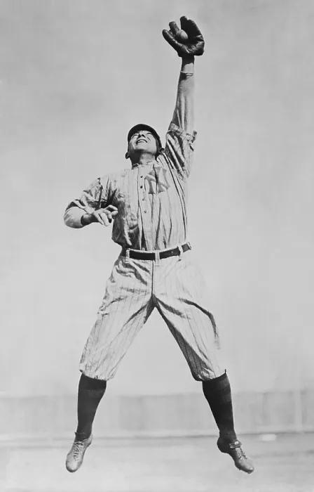 Framed Print : Frank Home Run Baker, in a New York Yankees uniform, reaching to catch a ball. He played in Major League Baseball from 1908 to 1922, and was with the Yankees from 1915-22
