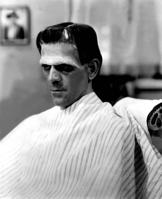 Framed Print : FRANKENSTEIN, Boris Karloff in makeup chair wearing makeup for the film, 1931