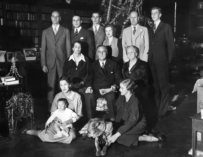 Framed Print : Franklin Roosevelt family on Christmas Day, 1932. President-elect and his family are shown grouped in front of the Christmas tree. L-R: Seated on the floor, Mrs
