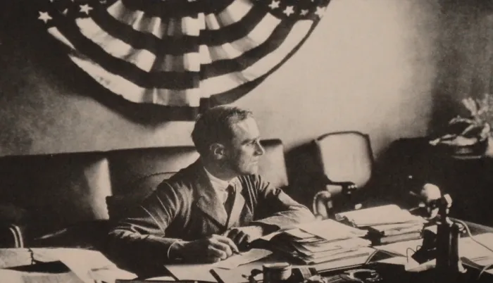 Framed Print : Franklin Roosevelt in his Hyde Park study in 1923. The striped bunting, correspondence, and telephone indicate FDR is back at work. (BSLOC_2013_8_1)