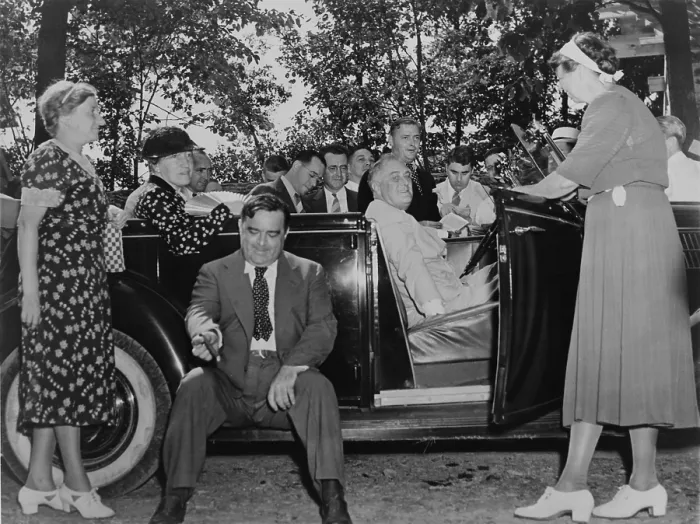 Framed Print : Franklin Roosevelt at the wheel of his specially outfitted car with notable guests. Left to right: Mrs