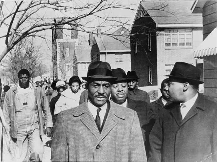 Framed Print : Fred Shuttlesworth (b. 1922) accompanied by Martin Luther King and Ralph Abernathy, leads a march for voter registration in Selma, Alabama in 1965. Rev