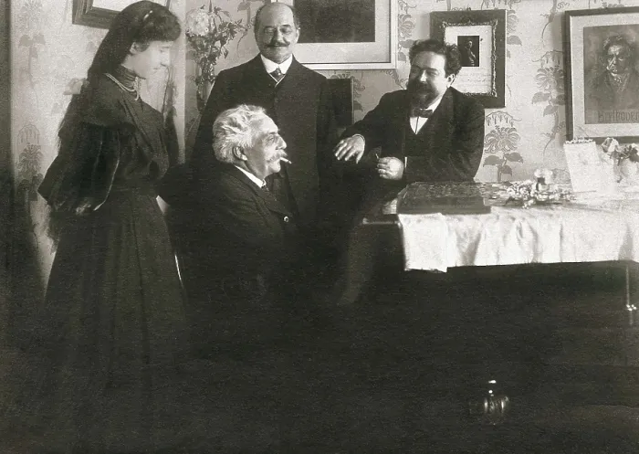 Framed Print : French composer Gabriel Faur (by the piano) with Spanish composer Isaac Albniz (right). With them, Clara Sansoni, Albniz's pupil and her father