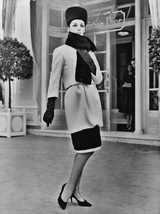 Framed Print : French designer, Christian Dior included a short hobble skirt in his 1959 collection. The design was accented by black seal, and worn with gloves and a high pillbox hat Framed Print : French designer, Christian Dior included a short hobble skirt in his 1959 collection. The design was accented by black seal, and worn with gloves and a high pillbox hat