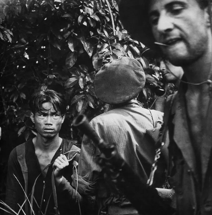 Framed Print : French Foreign Legionnaires with Viet Minh captive. Soldiers interrogate a suspected Viet Minh soldier found hiding in the jungle. Ca. 1954 Framed Print : French Foreign Legionnaires with Viet Minh captive. Soldiers interrogate a suspected Viet Minh soldier found hiding in the jungle. Ca. 1954