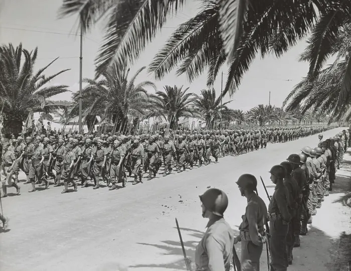 Framed Print : French soldiers marching in the Allied victory parade along Avenue Gambetta. American soldiers standing at parade rest in the foreground. May 20, 1943. (BSLOC_2013-12_80)